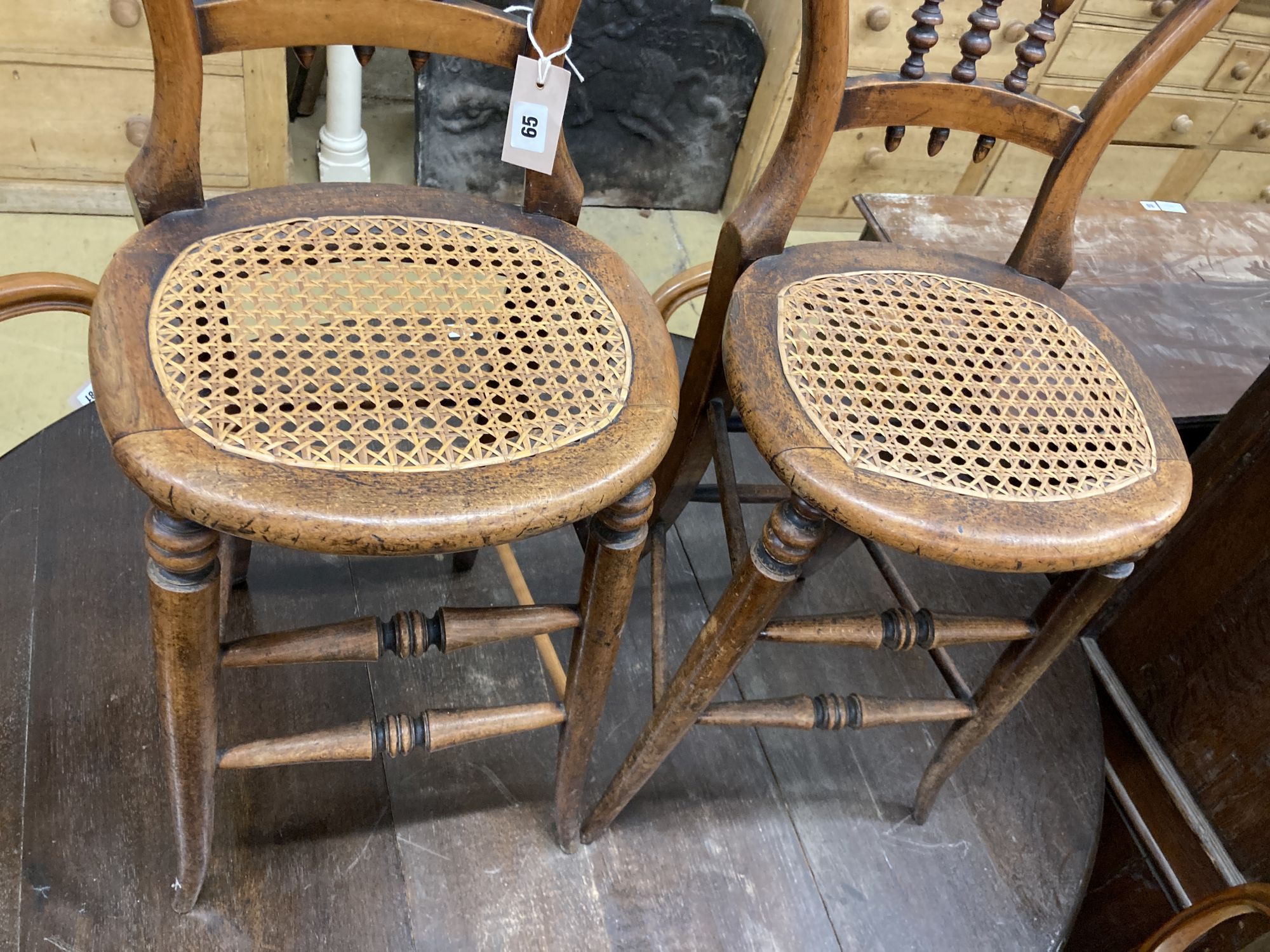 A pair of Victorian spindle back cane seat correction chairs